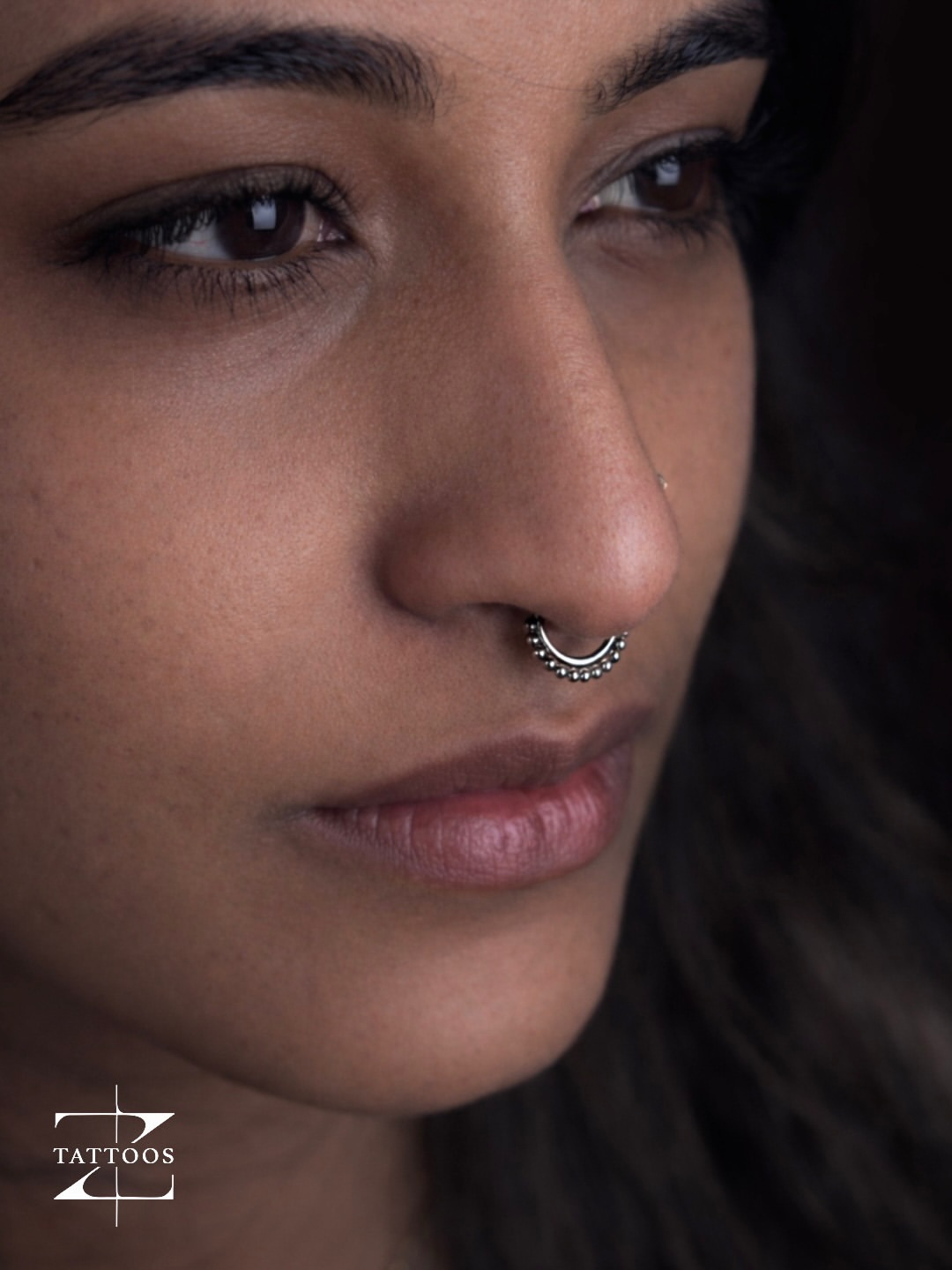 Fresh industrial piercing with implant-grade titanium bar.